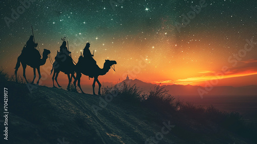 A silhouette of the Three Wise Men traveling on camels along the starlit path to reach Jesus at his birth.