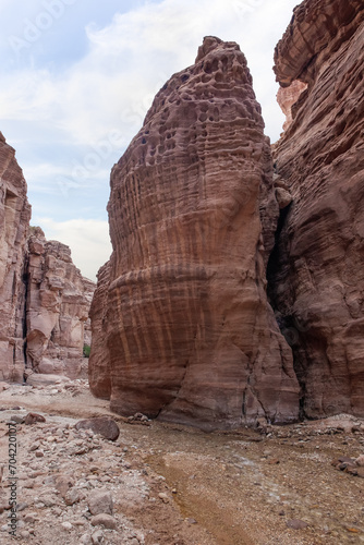 High rocks with beautiful natural patterns at end of hiking trail in Wadi Numeira gorge in Jordan