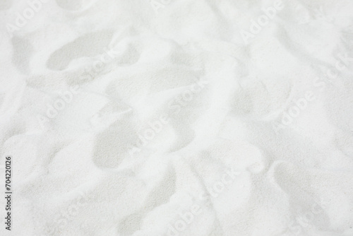 Selective focus.Top of white sand background.for material summer design ideas