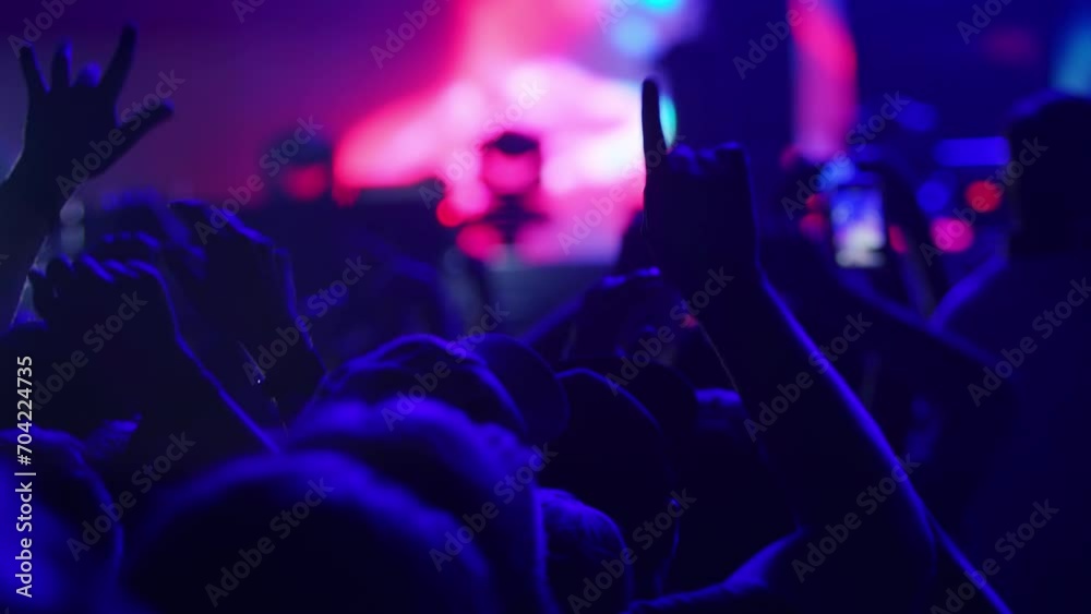 People having fun at a concert or music festival 4K, waving their hands, event entertainment, audience excitement, live performance atmosphere, concert, music festival, crowd, party.