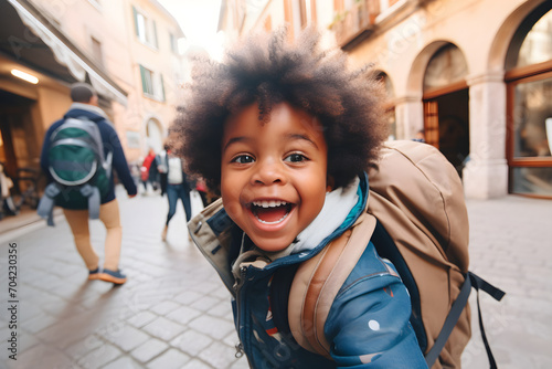 Happy traveller black child with backpack taking selfie picture - Travel blogger Life style and technology concept © sam