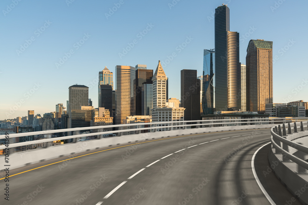 Empty urban asphalt road exterior with city buildings background. New modern highway concrete construction. Concept way to success. Transportation logistic industry fast delivery. Seattle. USA. Empty urban asphalt road exterior with city buildings background. New modern highway concrete construction. Concept way to success. Transportation logistic industry fast delivery. Seattle. USA.