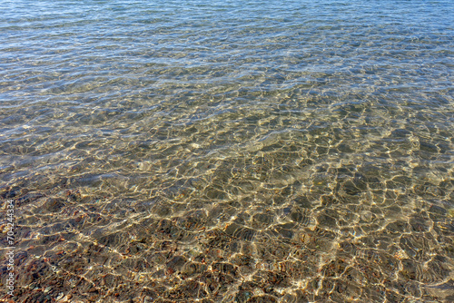 Clean transparent sea water  lake bottom and sand. Beautiful blue  turquoise transparent surface