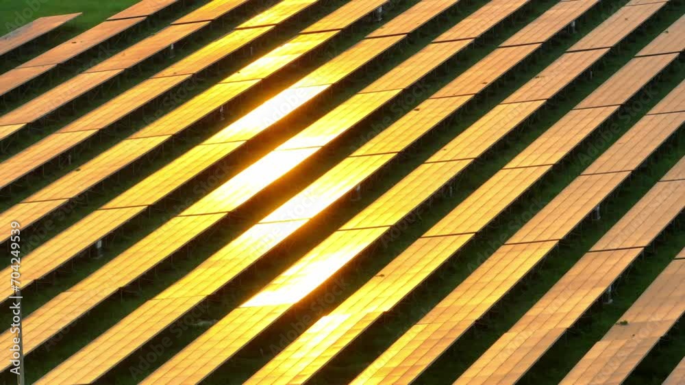As the sun sets in a blaze of golden glory, the photovoltaic power station mirrors its radiance, silently generating clean energy. Low-carbon energy and alternative energy sources concept. Drone.
As the sun sets in a blaze of golden glory, the photovoltaic power station mirrors its radiance, silently generating clean energy. Low-carbon energy and alternative energy sources concept. Drone.