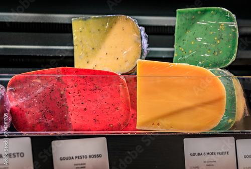 Selection of gourmet Gouda cheeses at an artisanal cheese maker shop in the Carre d Or historical district of Strasbourg, Alsace, France photo