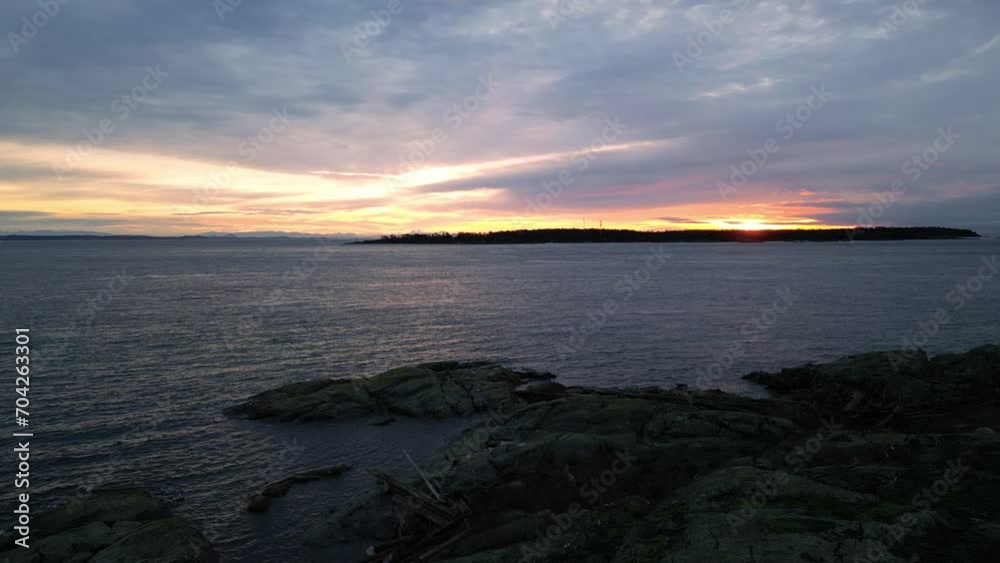 Rocky Ocean Coast, Dramatic Sunrise Sky. Winter Season. Vancouver Island, BC Canada. Rocky Ocean Coast, Dramatic Sunrise Sky. Winter Season. Vancouver Island, BC Canada.