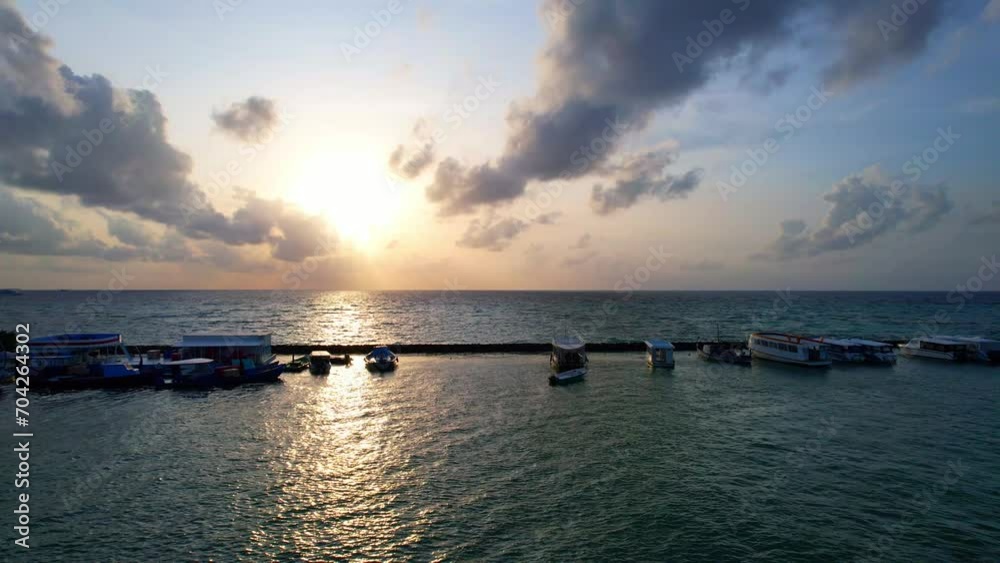 Huraa Island - Maldives - Aerial view of the sunset on the sea Huraa Island - Maldives - Aerial view of the sunset on the sea