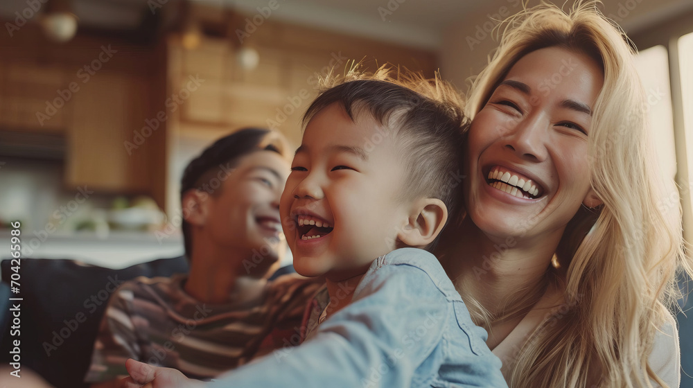 Portrait of a Korean family with parents and their young toddler kid at happy home - obrazy, fototapety, plakaty 