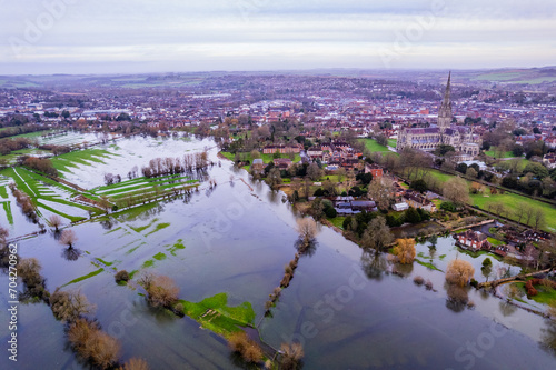 Aerial shot of flooded fields and burst river Avon near to Salisbury cathedral, Wiltshire, UK photo