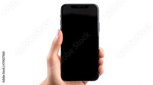  a woman's hand holding a black iphone in front of a white background with the back of the phone facing the camera.