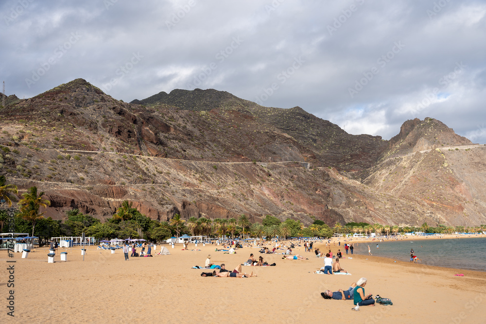 Fototapeta premium Playa De Las Americas, Tenerife, Spain - 03.12.2023: People at Playa De Las Americas, Tenerife, Spain