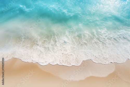An abstract sandy beach is graced by the light blue embrace of transparent waves and the sun s golden touch   a breathtaking summer vacation background concept banner. Created with generative AI tools