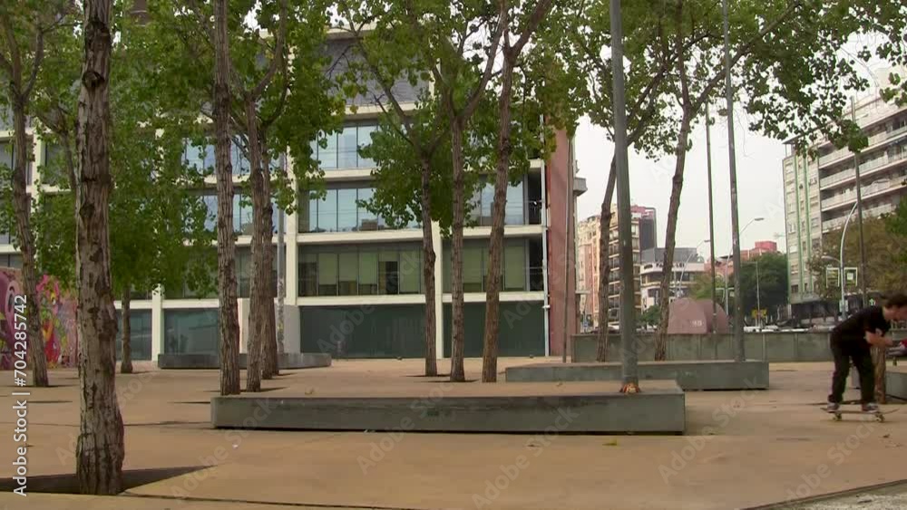 Skateboarder doing a balancing trick in Barcelona Spain Skateboarder doing a balancing trick in Barcelona Spain