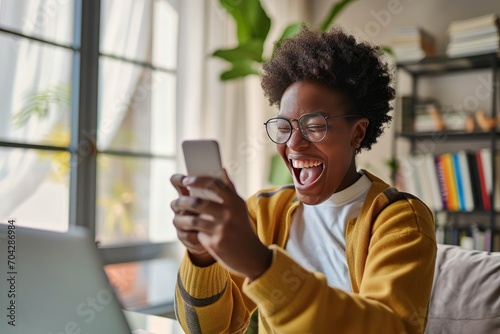 Young happy African American teen student feeling excited winner holding cellphone using mobile phone winning online, receiving great news on smartphone getting reward celebrating, Generative AI  photo