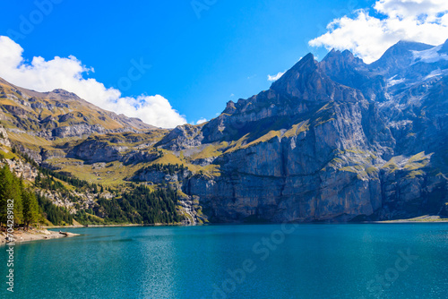 View of Oeschinen lake (Oeschinensee) and Swiss Alps near Kandersteg in Bernese Oberland, Switzerland