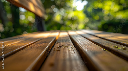 Cleaning garden furniture, wooden texture, bright, sunny day. 