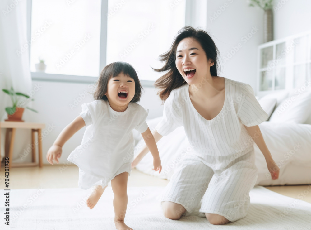 Asian mother hugging child and playing together Asian mother hugging child and playing together