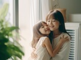 Asian mother hugging child and playing together