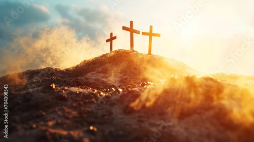 Three crosses on top of the mountain in the sunlight. Christian symbols.  photo