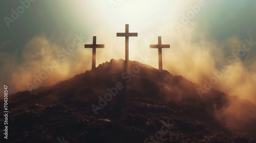Three crosses on top of the hill in the mist. 