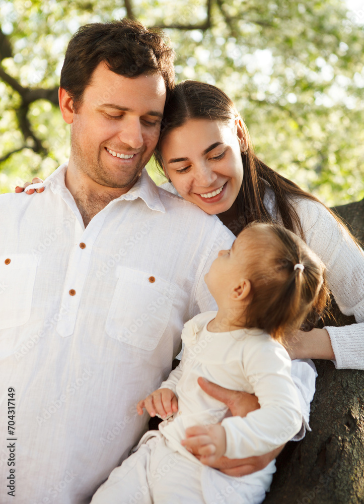 Happy young family with baby girl outdoors Happy young family with baby girl outdoors
