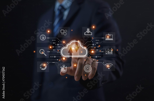 Businessmen use computers to visualize large online data in the cloud. It is a cloud server backup platform technology to ensure the safety of business data communications and data download systems.