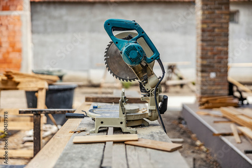 A cutting machine prepared for cutting wooden construction on building site.