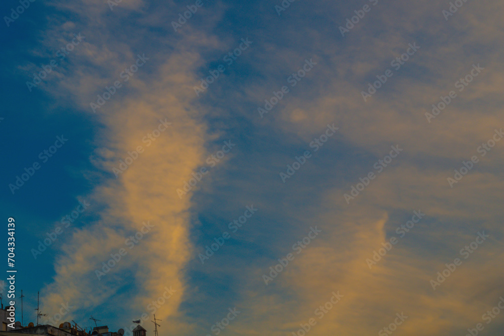 Foggy clouds in the sky create the effect of smoke, weather phenomena in nature. In windy weather Foggy clouds in the sky create the effect of smoke, weather phenomena in nature. In windy weather