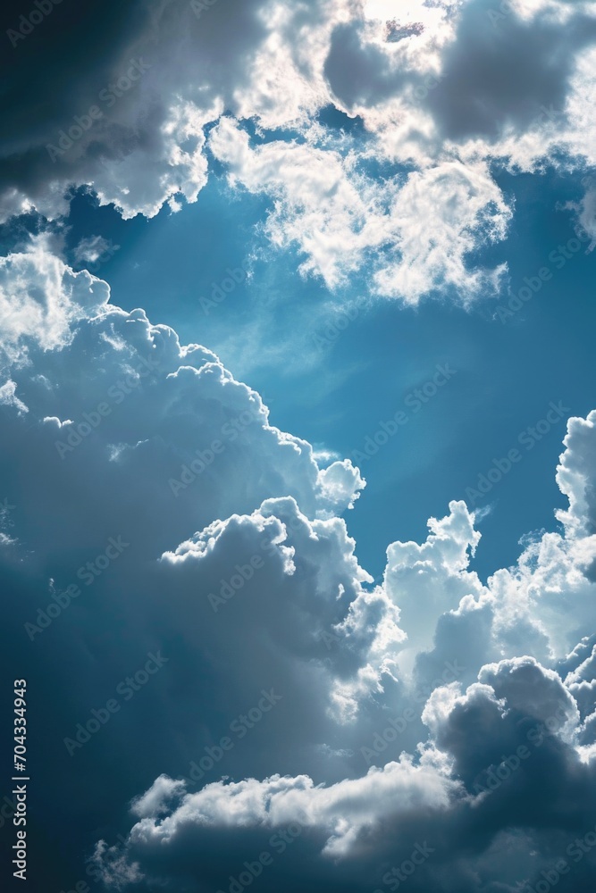 Naklejka premium A plane flying through a cloudy blue sky. Suitable for travel, aviation, and adventure-themed designs