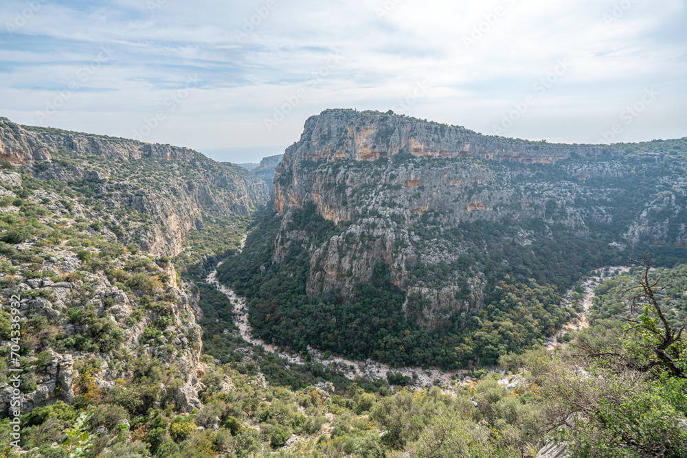 Naklejka premium Cennet and Cehennem (English: heaven and hell) are the names of two large sinkholes in the Taurus Mountains, in Mersin Province, Turkey. The sinkholes are among the tourist attractions of the province