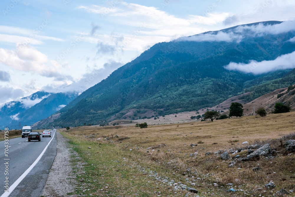 Road in the mountain region, mountainous background Road in the mountain region, mountainous background