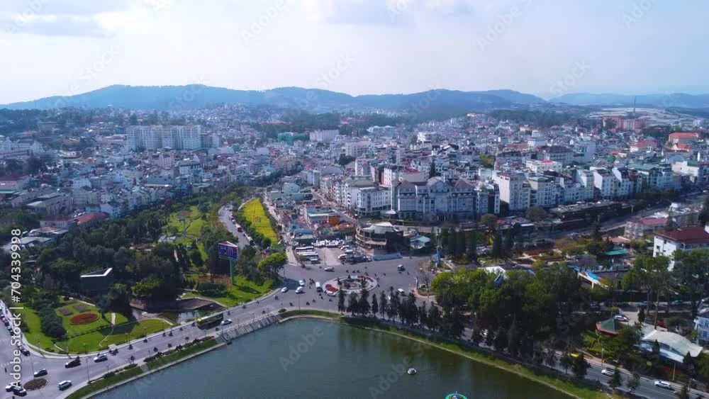 Aerial view of Da Lat City, Lam Dong Province. Drone flies straight towards Xuan Huong Lake. Aerial view of Da Lat City, Lam Dong Province. Drone flies straight towards Xuan Huong Lake.