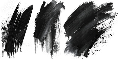 Four black paint strokes on a white background. Versatile and can be used in various design projects photo