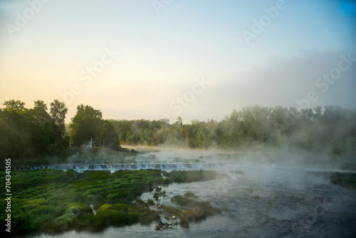 morning mist over the river. Waterfall in the river Venta. Venta hub.