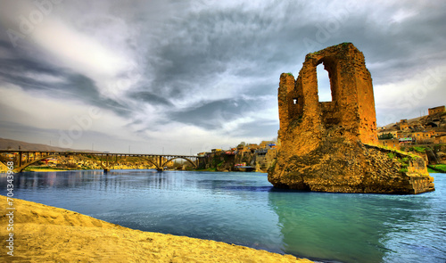 The ruins of the 4-arched Tigris Bridge built on the Tigris River in Hasankeyf are today located under the Ilisu Dam Lake. photo