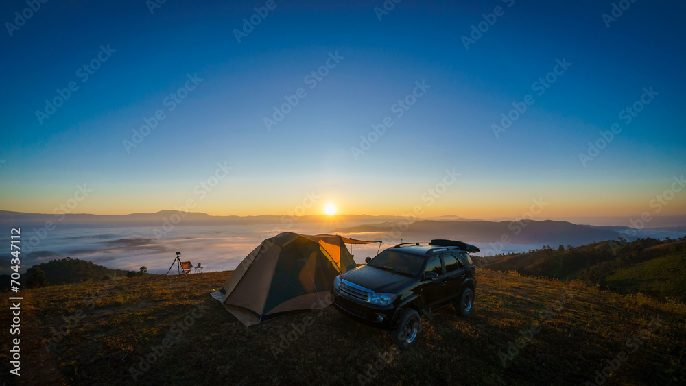 Beautiful scenery of the sea of mist in the morning at Camp Car Camping site with a viewpoint is fresh nature of Doi Balu Kho Mountain, Mae Chaem, Chiang Mai, Northern Thailand. Background concept.