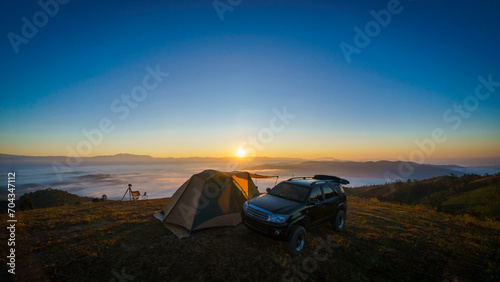 Beautiful scenery of the sea of mist in the morning at Camp Car Camping site with a viewpoint is fresh nature of Doi Balu Kho Mountain  Mae Chaem  Chiang Mai  Northern Thailand. Background concept.