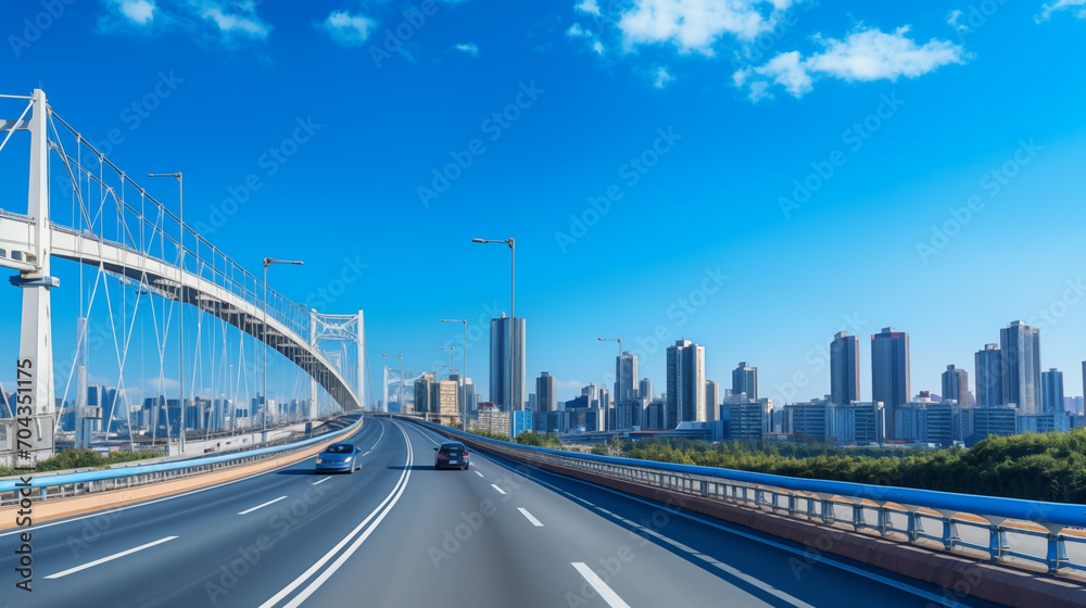 Fototapeta premium Aerial View of a Highway with a Distant Metropolis
