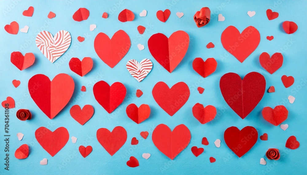 Red paper hearts on blue background. Origami valentines wallpaper card