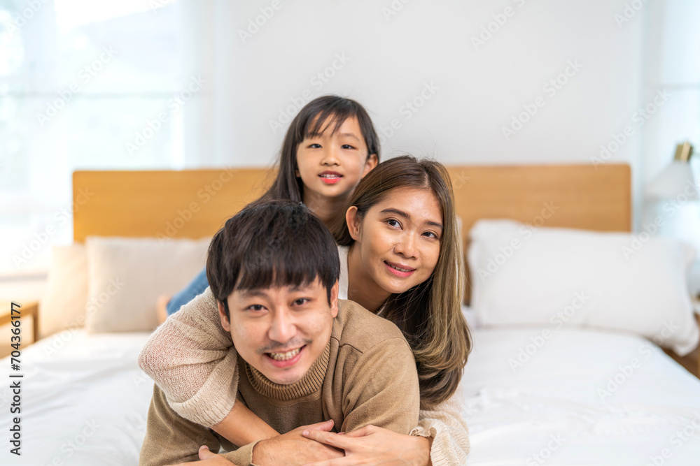 Portrait of enjoy happy love asian family father and mother holding hug cute little asian girl child smiling play and having fun moments good time, care, kid, support, insurance, child, at home