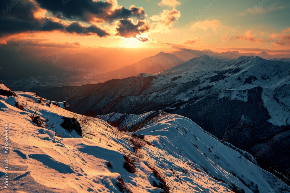 Slopes of snow-capped mountains against the backdrop of the rays of the setting sun. The concept for the development of tourism, mountaineering, skiing, rock climbing, excursions in the mountains.