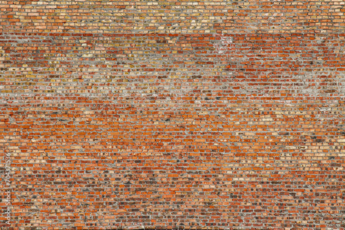 red brick structure on a large wall