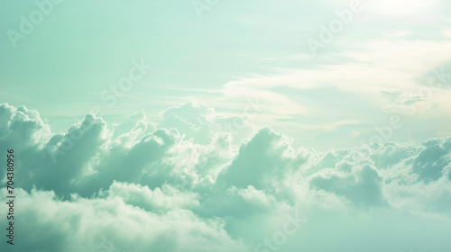 Soft, fluffy clouds, ethereal sky, tranquil scenery, light aqua tones, dreamy cloudscape, peaceful background, serene nature, heavenly view, airy texture, wide panorama.