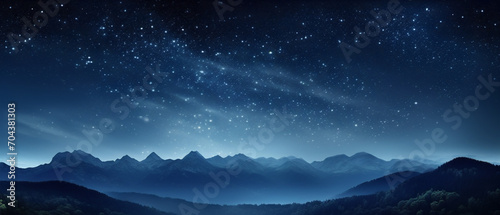 A starry night sky looms over dark mountain silhouettes  offering a stunning celestial display.