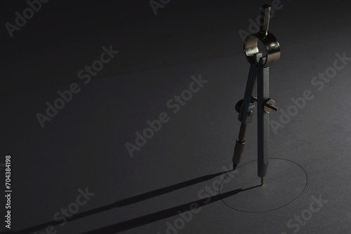 Den Helder, Netherlands. November 2023. A geometric pattern and compass on white background.