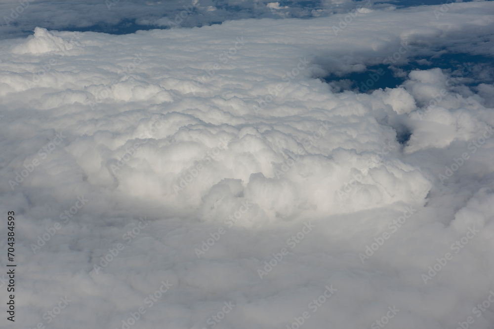 Obraz premium View of magnificent clouds and sky from above from an airplane.