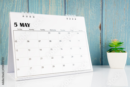 May 2024 calendar on the white table.