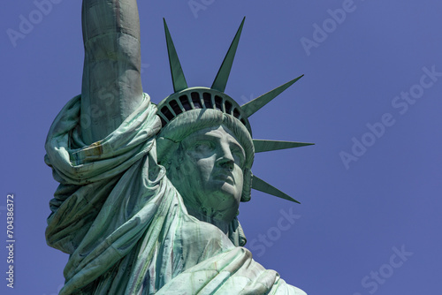 The great statue of liberty with its crown holding its torch, democratic symbol of New York (USA) and the Big Apple, famous in Manhattan and the world