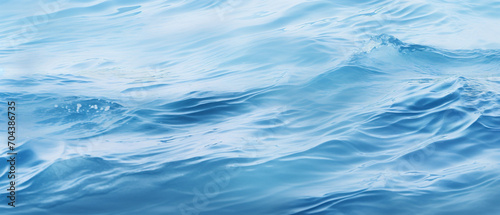 Tranquil blue water surface, gentle undulations creating subtle waves with calming ripples, aesthetic serenity.