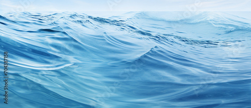 Tranquil blue water with gentle undulating ripples creating a serene, soothing abstract pattern.
